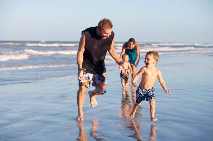 Beach Dad Chasing Kids